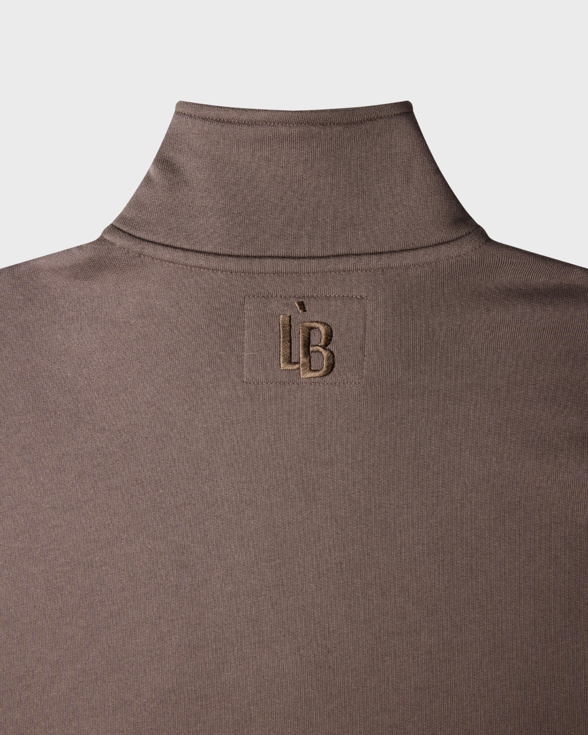 QUARTER ZIP SWEATER